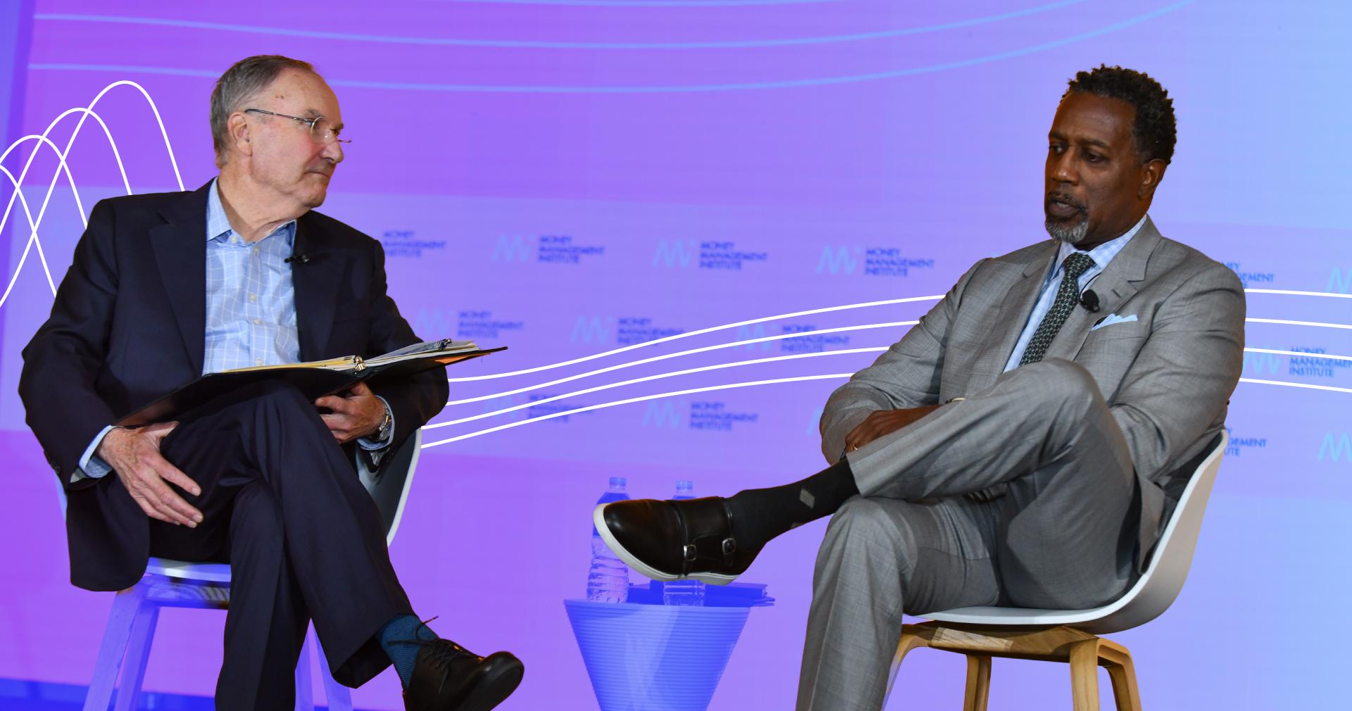 Diversity, Equity, and Inclusion: Image of two males having a conversation on stage at an MMI event